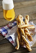 Puff pastry cheese straws and a glass of beer