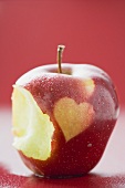 Apple with heart, partly eaten