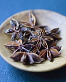 Star anise in shallow wooden dish