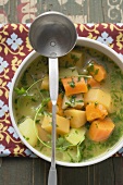 Vegetable soup in a pot (overhead view)