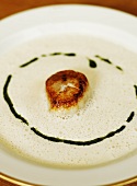 Creamy fish soup with fried scallop