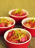 Rhubarb rice pudding in red bowls