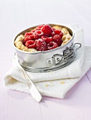 Raspberries in puff pastry shell in a springform pan