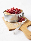 Redcurrants in puff pastry shell in a springform pan