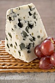 Blue cheese with grapes and salted sticks