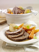 Roast beef with carrots and onions