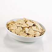 Organic spelt flakes in a dish
