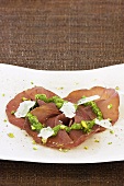 Bresaola with pesto, Parmesan and pistachios