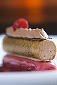 Wafer roll filled with chocolate cream on raspberry sorbet