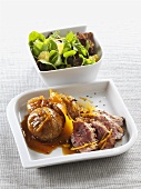Duck breast with orange sauce and figs, side salad