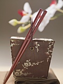 Asian container with chopsticks