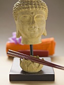 Buddha head and chopsticks