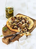 Pizza topped with artichokes, olives and onions