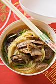 Noodle soup with beef and mushrooms (China)