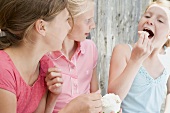 Three girls eating ice cream