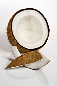Half a coconut with two wedges of coconut