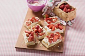Several puff pastry slices with strawberries & cream
