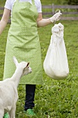Woman holding cheese curds in a cloth