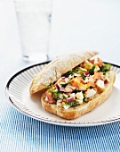 Salmon, egg, red onions and dill on ciabatta