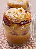 Plum cake with crystallised ginger baked in a jar