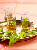 Glasses of mint tea on a tray