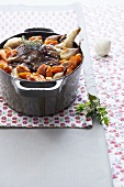 Oven-braised leg of lamb with vegetables