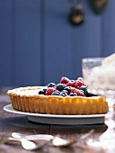 A lemon tart with berries