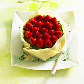 Strawberry tart with white chocolate and pistachios
