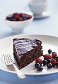 A piece of chocolate cake with berries