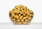 Glass bowl of peanuts