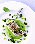 Fish fillet with sesame on pea puree and lime vinaigrette