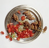Dates and rose petals on silver tray