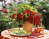 Melon, fruit juice & arrangement of roses with lady's mantle