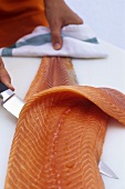 Filleting salmon (removing the skin)