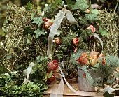 Wire basket with hay and ivy wreath