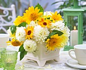 Arrangement of dahlias, marigolds and sunflowers