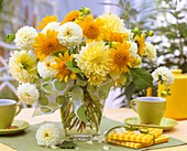 An arrangement of dahlias and sunflowers