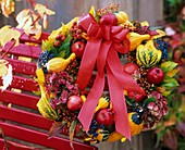 Wreath of pumpkins, apples, Guelder rose berries, hydrangeas