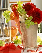 Champagne cooler with champagne bottle, Bells of Ireland & dahlias