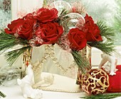 Silver vase with red roses, Eastern white pine & angel's hair