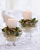 Viburnum tinus used as candle rings, white candles, crystal bowl