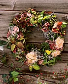 Door wreath with carnations and blackberry shoots