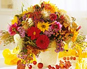 Arrangement of dahlias, fountain grass, Hypericum berries