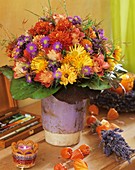 Autumn arrangement of roses, chrysanthemums and asters