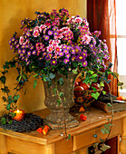 Arrangement of Michaelmas daisies, chrysanthemums, privet berries
