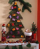Advent calendar above mantelpiece with Christmas decorations