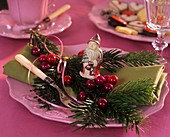 Napkin decoration with Nordmann fir, baubles & Father Christmas