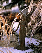 Metal angel with hoar frost