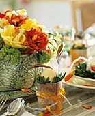 Easter table decoration with flowers and eggcups