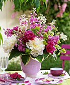 Arrangement of peonies, stocks and lady's mantle 